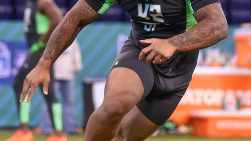 Mississippi defensive lineman Robert Nkemdiche runs a drill at the NFL football scouting combine, Sunday, Feb. 28, 2016, in Indianapolis. (AP Photo/L.G. Patterson)