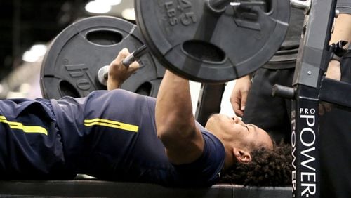 Mississippi tight end Evan Engram performs the bench press at the 2017 NFL football scouting combine Friday, March 3, 2017, in Indianapolis. (AP Photo/Gregory Payan)