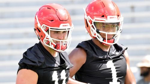 Georgia quarterbacks Jake Fromm (11) and Justin Fields (1) during the Bulldogs' practice  Saturday, Aug. 4, 2018, at Sanford Stadium in Athens.