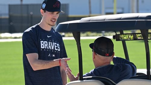 Braves starting pitcher Max Fried (left) talks to manager Brian Snitker during the third of the Braves spring training at CoolToday Park, Wednesday, Feb. 15, 2023, in North Port, Fla. (Hyosub Shin / Hyosub.Shin@ajc.com)
