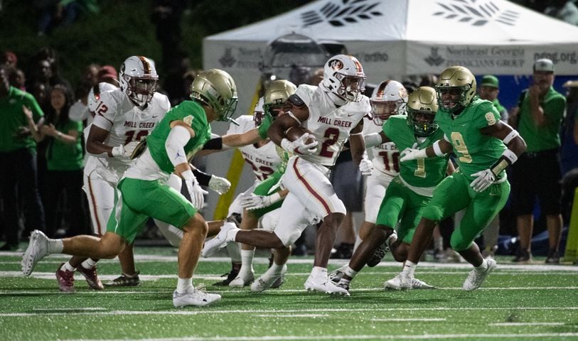 Caleb Downs takes the ball for Mill Creek against Buford. (Photo Jamie Spaar for The Atlanta Journal-Constitution)