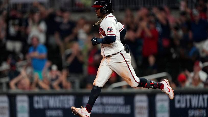 Atlanta Braves' Ozzie Albies runs the bases after hitting a two-run home run during the fifth inning of the team's baseball game against the New York Mets on Wednesday, June 30, 2021, in Atlanta. (AP Photo/John Bazemore)