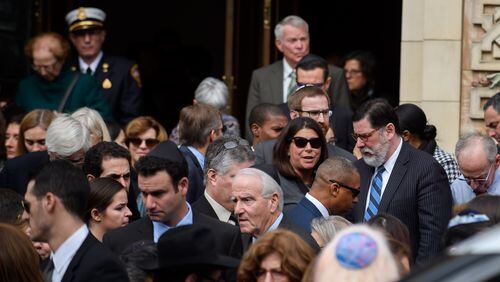Pittsburgh Mayor Bill Peduto (R) joins mourners outside Rodef Shalom Temple following the funeral of brothers Cecil Rosenthal, 59, and David Rosenthal, 54 on Tuesday in Pittsburgh, Pa. The Rosenthal Brothers were among the 11 victims killed in the mass shooting at the Tree of Life Synagogue on October 27, 2018. Jeff Swensen/Getty Images
