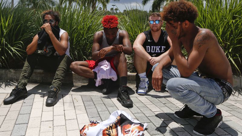 Fans gather and cry after a memorial for the rapper, XXXTentacion, Wednesday, June 27, 2018, in Sunrise, Fla.