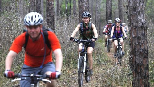 The Woodstock City Council has approved spending $24,730 to upgrade two mountain bike trails in a city park. AJC FILE
