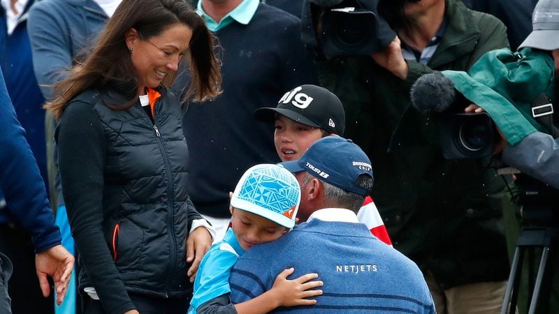 Matt Kuchar meets his children and wife, Sybi Kuchar,  on the 18th green during the final round of the 146th Open Championship at Royal Birkdale on July 23, 2017, in Southport, England.