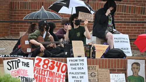 Pro-Palestinian protesters chant at Tate Plaza on University of Georgia campus, Tuesday, April 30, 2024, in Athens.  (Hyosub Shin / AJC)