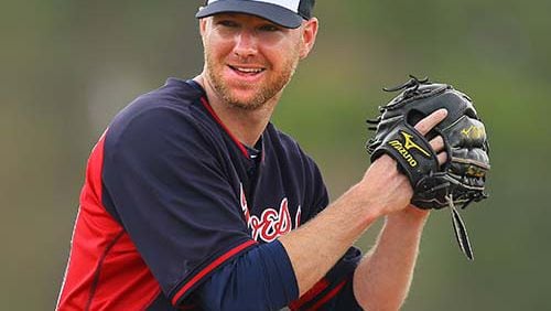 Braves pitcher Jonny Venters smiles as he prepares to make a pitch on Friday, Feb. 21, 2014, in Lake Buena Vista, FL.