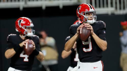 Falcons quarterback Desmond Ridder (9) and quarterback Taylor Heinicke (4) prepare to throw the ball during warm-ups before the Falcons face the Washington Commanders on Sunday, October 15, 2023, at Mercedes-Benz Stadium in Atlanta. 

Miguel Martinez/miguel.martinezjimenez@ajc.com