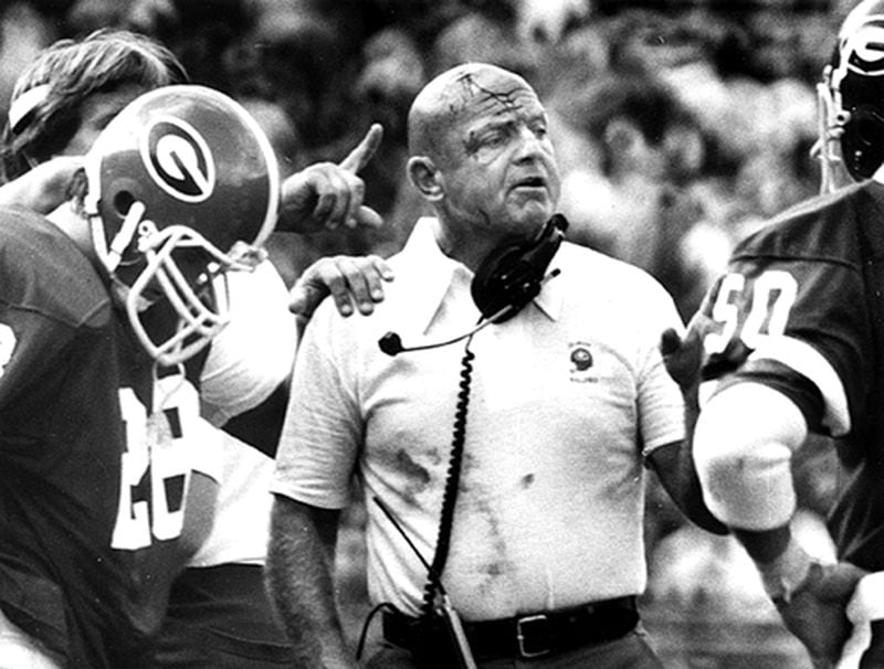  As a longtime UGA coach, an Erk Russell trademark was to butt heads with his players. At a 1979 game, Russell's motivational move left him with a bloodied forehead. (Billy Downs /AJC staff)
