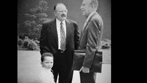 Wiley A. Perdue (center) with the late Dr. Hugh M. Gloster Sr., former president of Morehouse College, and Perdue’s grandson, Christian A. Perdue. CREDIT: Alisa Perdue