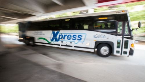 A GRTA Xpress bus leaves after picking up passengers at the Dunwoody Marta Station on Monday, Aug. 10, 2015. BRANDEN CAMP/SPECIAL