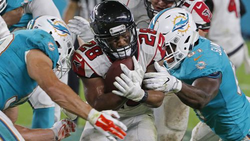 Terron Ward  of the Atlanta Falcons  is brought down by  Joby Saint Fleur  of the Miami Dolphins, right during their preseason game at Hard Rock Stadium on August 10, 2017 in Miami Gardens, Florida.  (Photo by Joe Skipper/Getty Images)