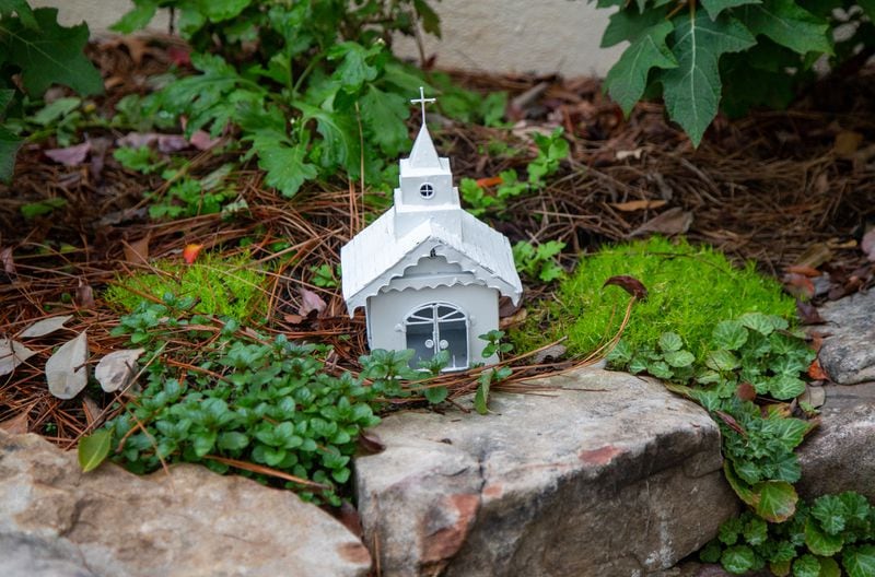 A small model church sits among the plants in Sarahs' Garden. PHIL SKINNER FOR THE ATLANTA JOURNAL-CONSTITUTION.