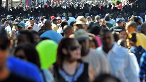 Thousands of people attend the Sweet Auburn Heritage Festival on Historic Auburn Avenue in Atlanta in 2010. Tracking the city's black and white populations over the decades is a trickier task than it sounds. (Hyosub Shin / hshin@ajc.com)