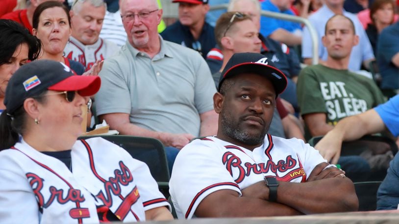 Braves fans react in shock after the Braves allowed 11 runs in the first two innings. Curtis Compton/ccompton@ajc.com