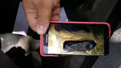 Andrew Zuis, of Farmington, Minn., took this photo showing a replacement Samsung Galaxy Note 7 phone that he said melted in the hands of his 13-year-old daughter. Concerns about batteries in personal devices causing fires is prompting some airlines to add “fire containment” bags. (Andrew Zuis via AP)