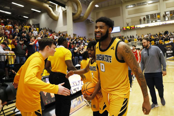 Kennesaw State forward Demond Robinson smiles with teammates after the victory against the Liberty Flames.
 Miguel Martinez / miguel.martinezjimenez@ajc.com