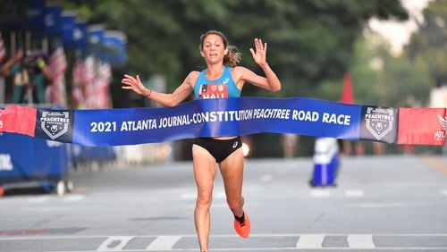 Sara Hall won the elite female division at The Atlanta Journal-Constitution Peachtree Road Race on Sunday morning as the AJC Peachtree Road Race returned in-person for the second day Sunday for the holiday tradition.  Hyosub Shin / Hyosub.shin@ajc.com