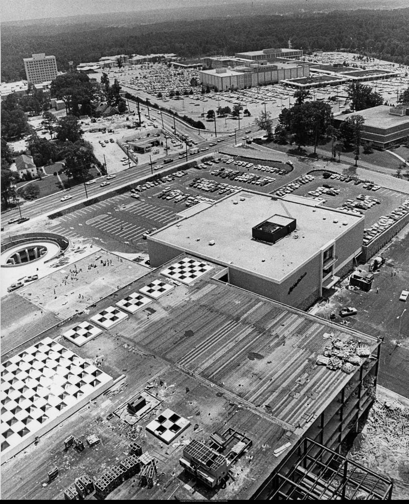Aerial view of the Lenox Square Mall area, Atlanta, Georgia, September 1968. 1968-09 Original caption: "Atlanta's Lenox area: The scene of shopping centers and high-rise office buildings in rapidly growing area. Phipps Plaza, with Saks Fifth Avenue store (foreground), rising across Peachtree Road from Lenox Square (foreground)." Photo: Marion Crowe