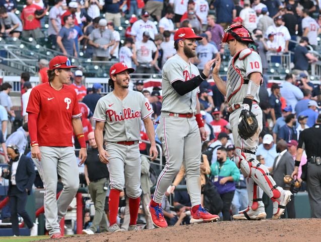 Phillies celebrate winning game one of the baseball playoff series between the Braves and the Phillies at Truist Park in Atlanta on Tuesday, October 11, 2022. (Hyosub Shin / Hyosub.Shin@ajc.com)