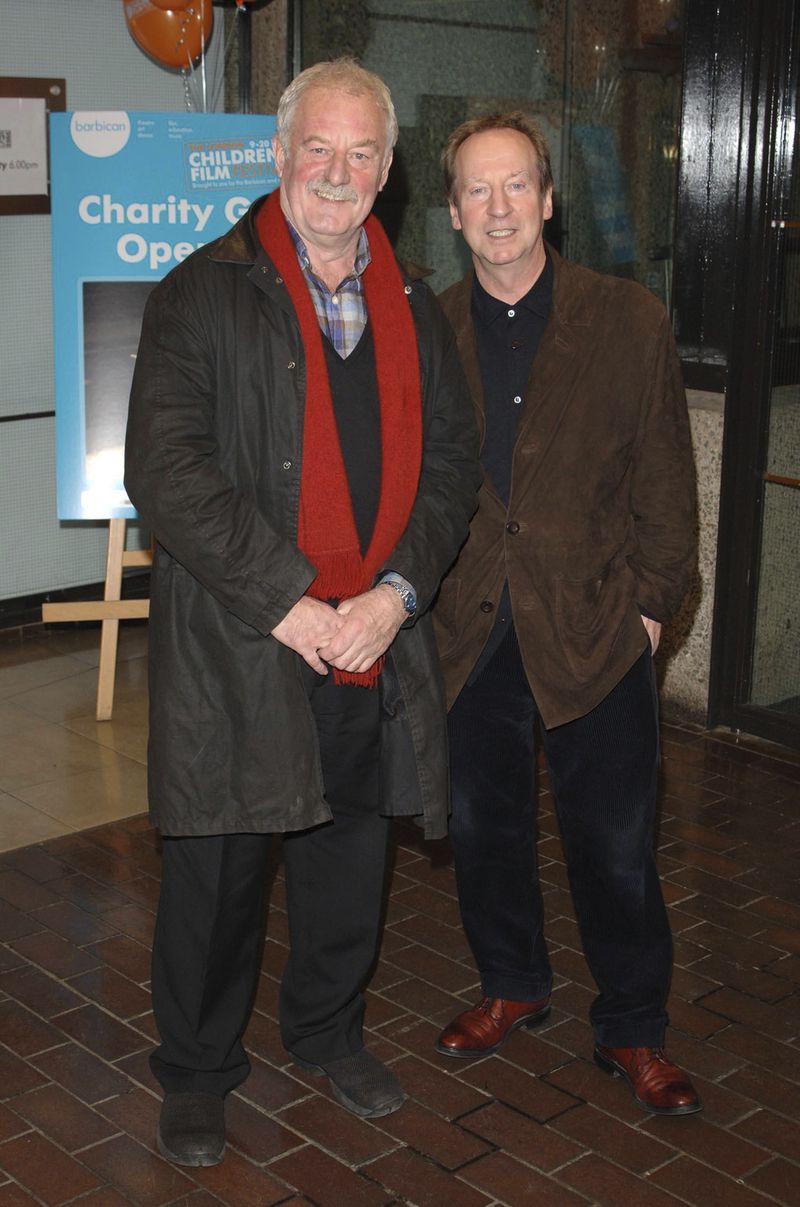 Actors Bernard Hill, left, and Bill Paterson attend the U.K. premiere of the London Children's Film Festival screening, "Chicken Little," at the Barbican Cinema, in central London, Sept. 11, 2005. Hill, who delivered a rousing battle cry before leading his people into battle in “The Lord of the Rings: The Return of the King" and went down with the ship as captain in “Titanic,” has died. Hill, 79, died Sunday morning, May 5, 2024, agent Lou Coulson said. (Ian West/PA via AP)