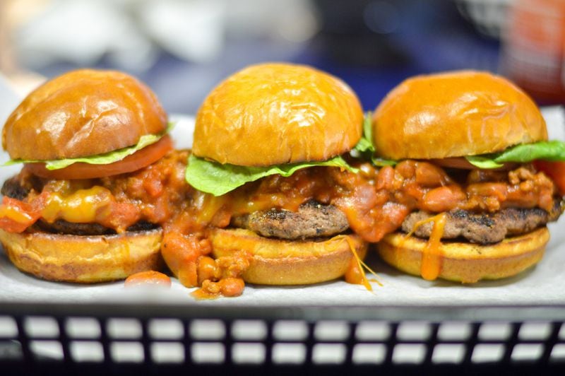 Sloppy Chili-Chez sliders are served as a trio at Sliders Burger Joint. CONTRIBUTED BY HENRI HOLLIS