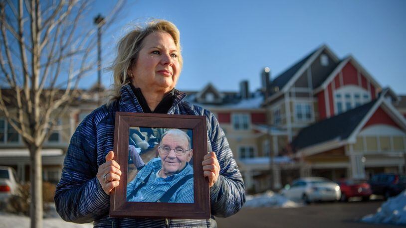 Joan Maurer held a photograph of her late father Gerald Seeger who died nearly a year ago at this senior home, Lighthouse of Columbia Heights. Attorneys for the senior facility are claiming that her wrongful death lawsuit should be thrown out because she signed an arbitration clause. (Glen Stubbe/Minneapolis Star Tribune/TNS)