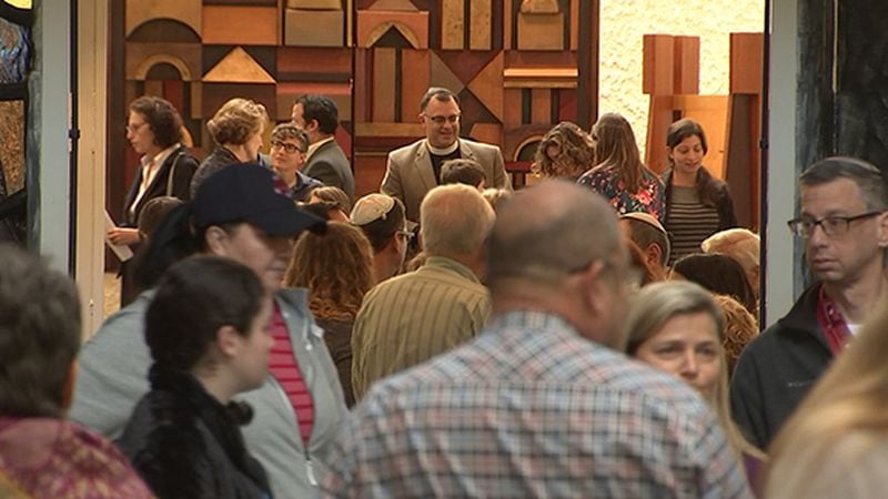 People gather for a vigil on Sunday, Oct. 28, 2018, at Temple Sinai in Sandy Springs to remember those killed a day earlier in a shooting at a Pittsburgh synagogue. (Photo: Channel 2 Action News)