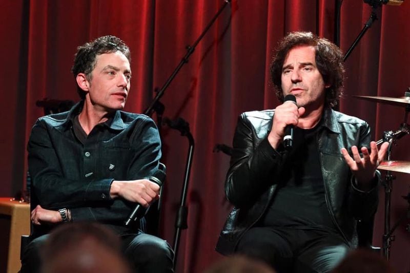 Andrew Slater (right) talks with Jakob Dylan at an event for 'Echo in the Canyon." Slater worked as the pop music writer for the Atlanta Journal in the late-'70s and attended Emory University. He also served as the CEO of Capitol Records in the early 2000s.