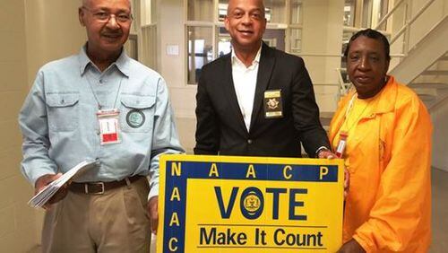 The DeKalb NAACP’s “Voices Beyond Bars” voter registration drive registered 134 inmates at the DeKalb County Jail this week.  From left, volunteer George Turner, Sheriff Jeffrey L. Mann and Georgia NAACP Political Action Chair Vivian Moore. (Photo by DeKalb County Sheriff’s Office)