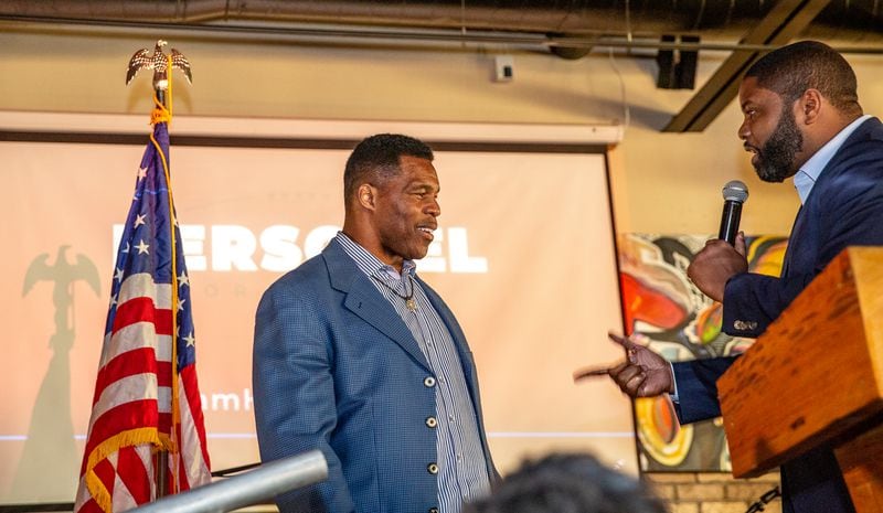 Republican U.S. Senate candidate Herschel Walker, left, has yet to issue his campaign finance report for the past three months. In the previous quarter, however, he took in nearly $6.2 million and ended with about $7 million in the bank. (Jenni Girtman for The Atlanta Journal-Constitution)
