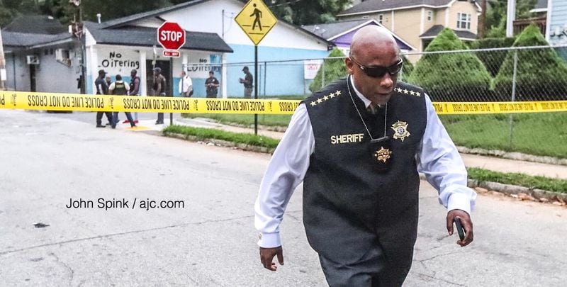 Clayton County Sheriff Victor Hill arrives on scene after a shooting suspect killed himself in northwest Atlanta on Wednesday morning.
