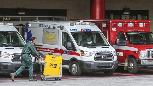 Ambulances are lined up at Grady Memorial Hospital. Photo: JOHN SPINK/JSPINK@AJC.COM