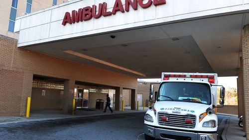 Clayton County ambulances line up in the driveway outside the emergency room of the Southern Regional Medical Center in Riverdale. KENT D. JOHNSON/ KDJOHNSON@AJC.COM