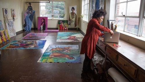 Artist Angela Davis Johnson organizes her new studio at PushPush in College Park. Contributed by Steve Schaefer