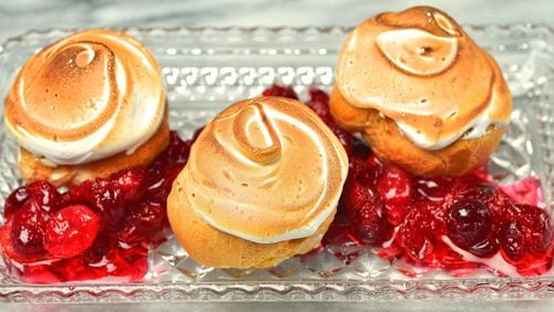 Eggnog Cream Puffs with Eggnog Pastry Cream and orange-scented cranberries. (Chris Hunt/Special)