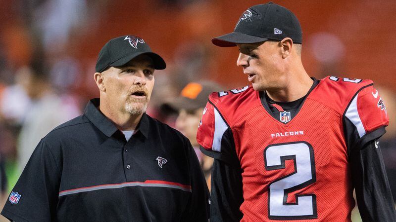 Falcons head coach Dan Quinn and quarterback Matt Ryan talk as they leave the field after the Falcons defeated the Cleveland Browns at FirstEnergy Stadium on Aug. 18, 2016 in Cleveland.