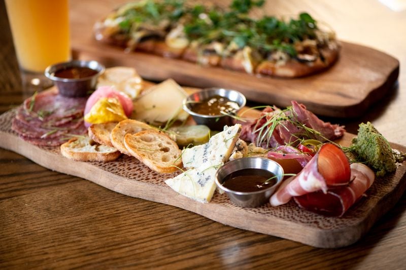 Bar (n) Booze (n) Bites Cheese and Meat Smorgas-board with house-made crackers, olive tapenade, seasonal pickles, Vidalia relish, and local jam.  (Mia Yakel for The Atlanta Journal-Constitution)