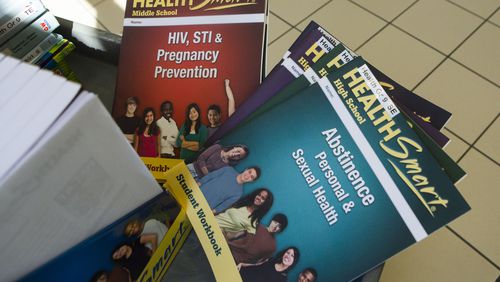 Comprehensive sexual and health education textbooks and learning materials are shown on Wednesday, March 8, 2023, at Gwinnett County Schools headquarters in Suwanee. The materials are being considered for use in Gwinnett County. (Christina Matacotta for The Atlanta Journal-Constitution)