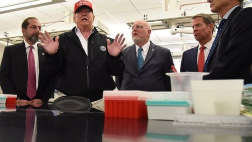 President Donald Trump visited the Atlanta-based U.S. Centers for Disease Control and Prevention on Friday to praise its work as the nation deals with a growing number of cases of coronavirus.