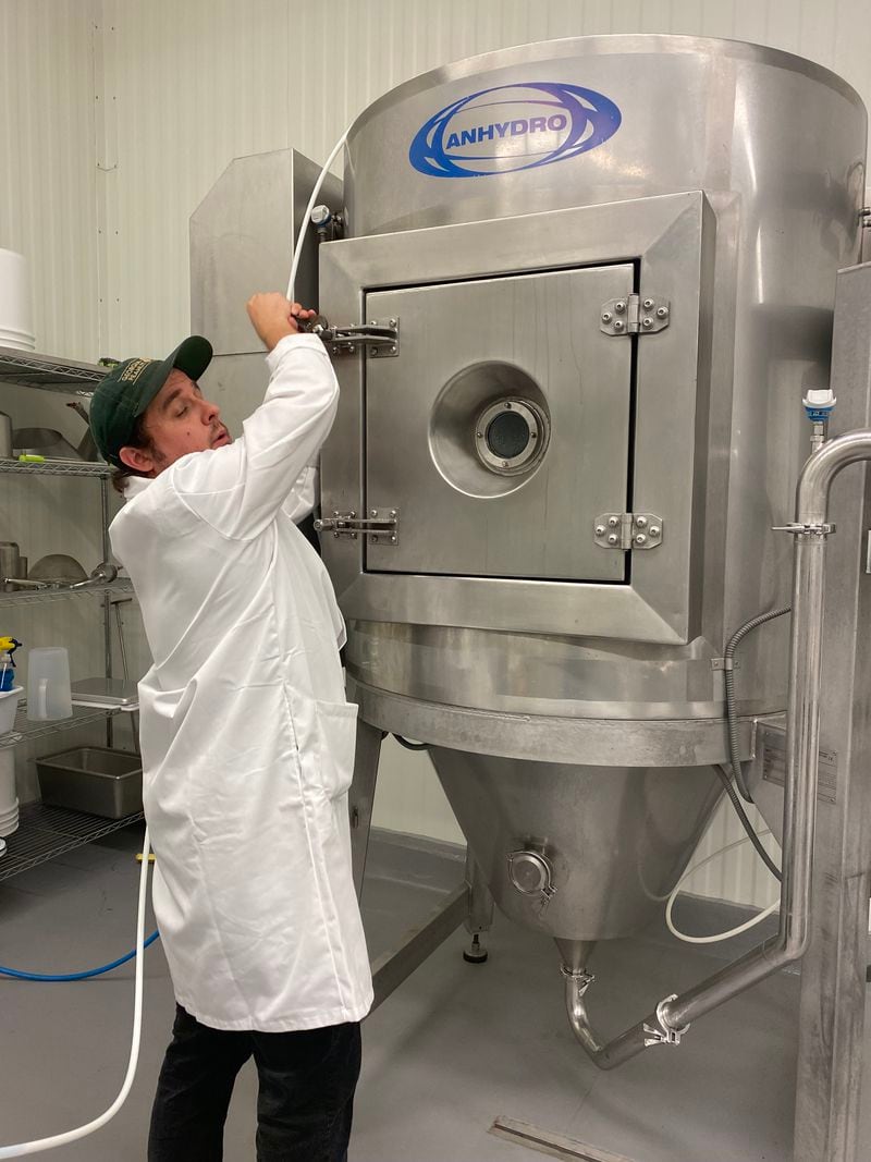 Bobby Goss works with the spray dryer at the UGA Food Product Innovation and Commercialization Center in Griffin, Ga. A spray dryer is used in the food, chemical and pharmaceutical industries to turn liquids into solids. (Ligaya Figueras / ligaya.figueras@ajc.com)
