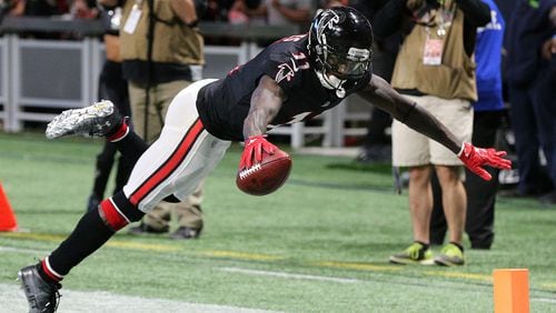 Falcons wide receiver Julio Jones reaches to score his second touchdown on the day soaring into the end zone during the second quarter against the Buccaneers in a NFL football game on Sunday, November 26, 2017, in Atlanta.   Curtis Compton/ccompton@ajc.com