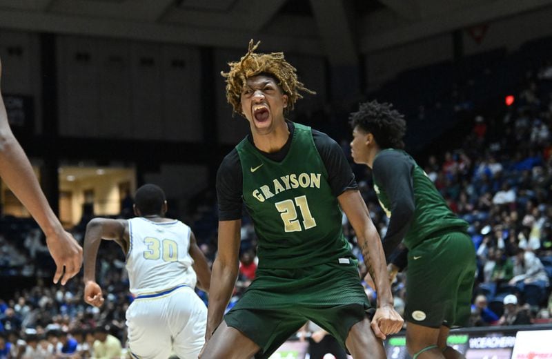 Grayson's Jacob Wilkins (21) reacts after dunking the ball during the second half of Saturday's win over McEachern in the Class 7A boys championship game.