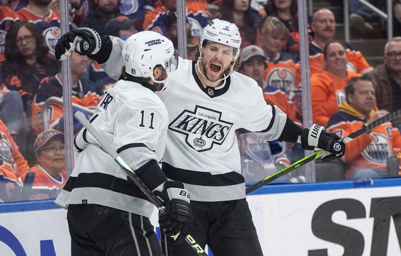 Los Angeles Kings' Adrian Kempe (9) and Anze Kopitar (11) celebrate a goal against the Edmonton Oilers during the first period of Game 2 of an NHL hockey Stanley Cup first-round playoff series Wednesday, April 24, 2024, in Edmonton, Alberta. (Jason Franson/The Canadian Press via AP)