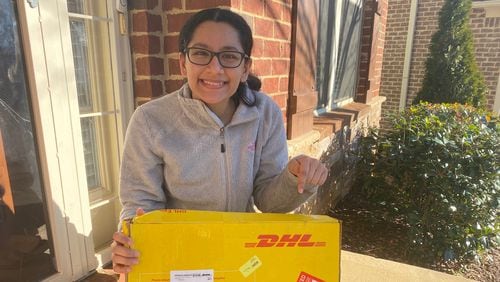 Alpharetta High School senior Davita Verma recently accepted 10 laptops on behalf of her nonprofit, Pencils for Success, from the DHL Helping Learners program. (Courtesy DHL and Davita Verma)