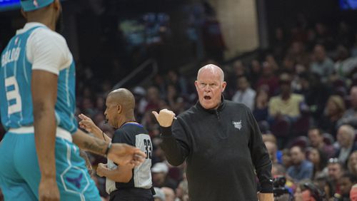 Charlotte Hornets head coach Steve Clifford, right, talks with Marques Bolden (3) during the first half of an NBA basketball game against the Cleveland Cavaliers in Cleveland, Sunday, April 14, 2024. (AP Photo/Phil Long)