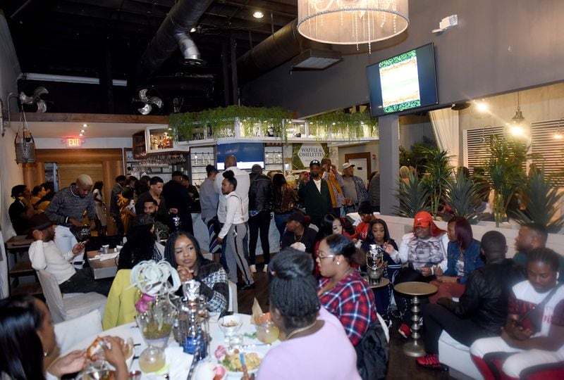 12/17/2019 -- Atlanta -- Inside musician and "Love and Hip Hop" alum K. Michelle's and Shema Fulton's new restaurant Puff & Petals Lounge. The pop up eatery is located in West End Atlanta.. Ryon Horne/RHORNE@AJC.COM