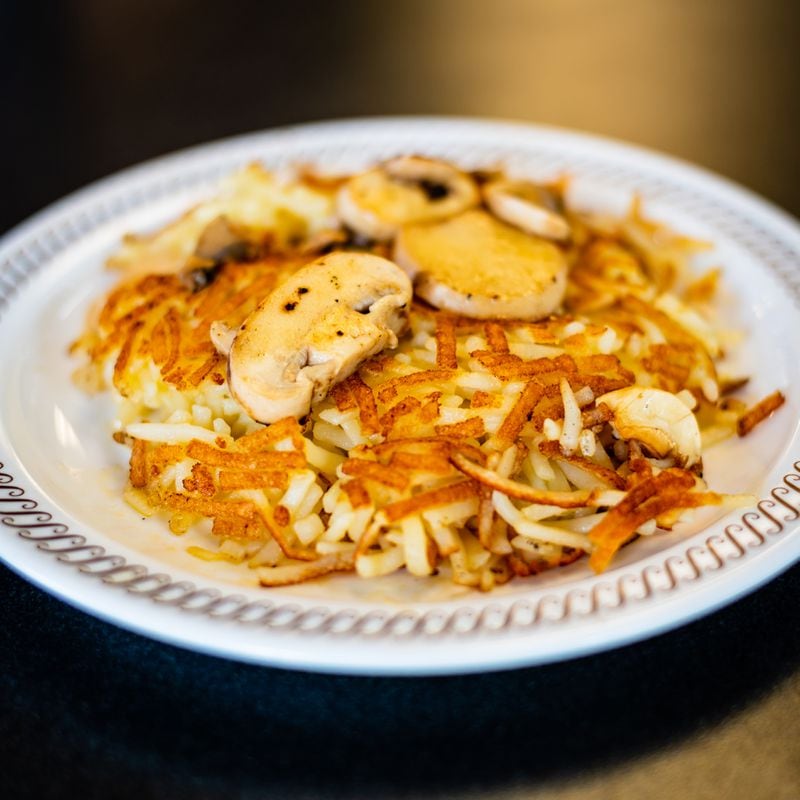 Capped hash browns from Waffle House with grilled mushrooms.