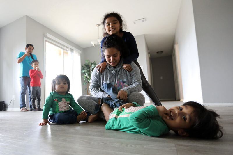 While Yair worked 60- to 70-hour weeks as a cook at a restaurant in Decatur, Alejandra mostly stayed home to look after their kids, ages 1 to 9. (Photo: Miguel Martinez for the AJC)
